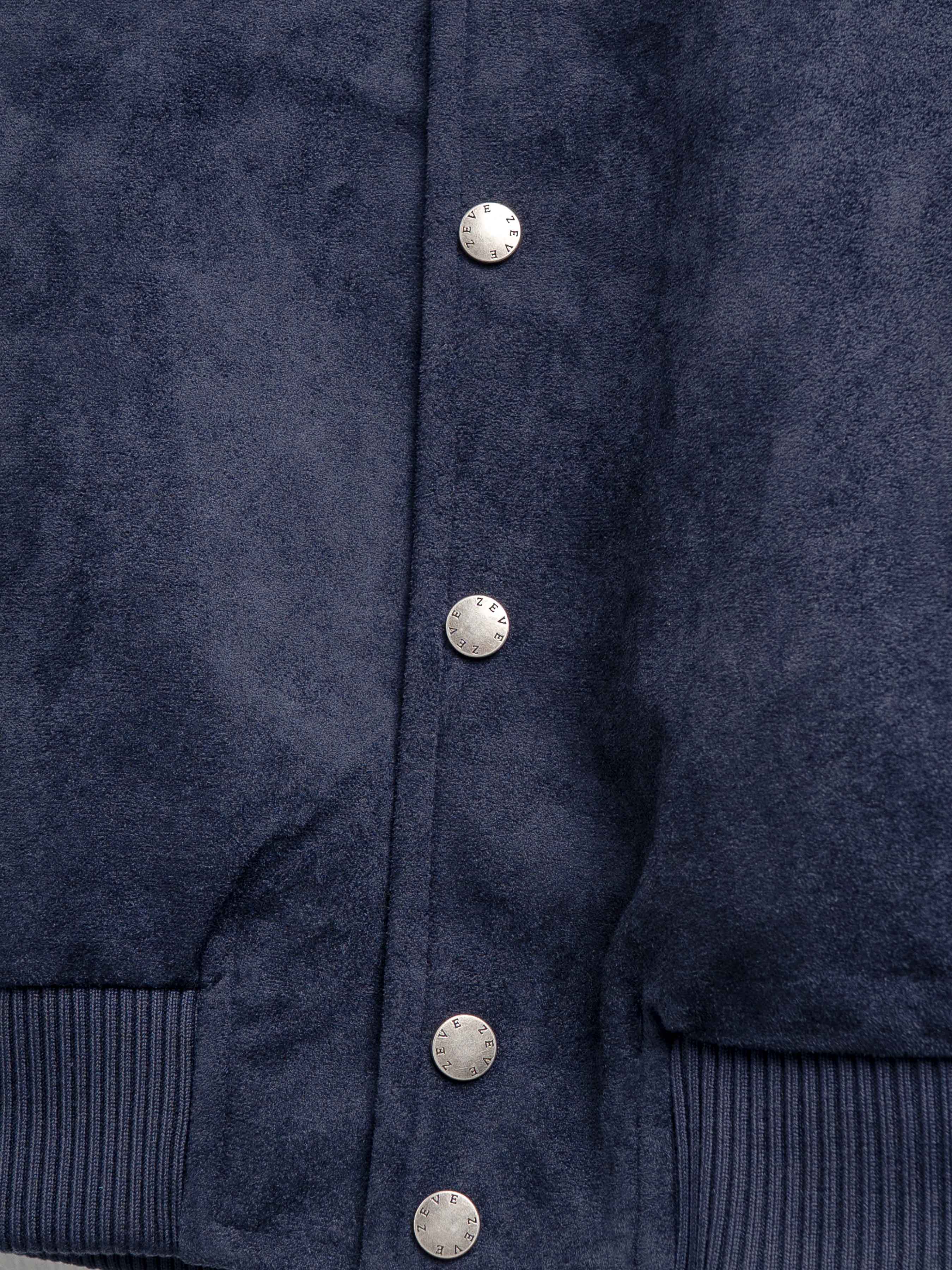 Navy blue men's jacket with textured fabric and branded buttons, stylish outerwear for formal or casual wear.