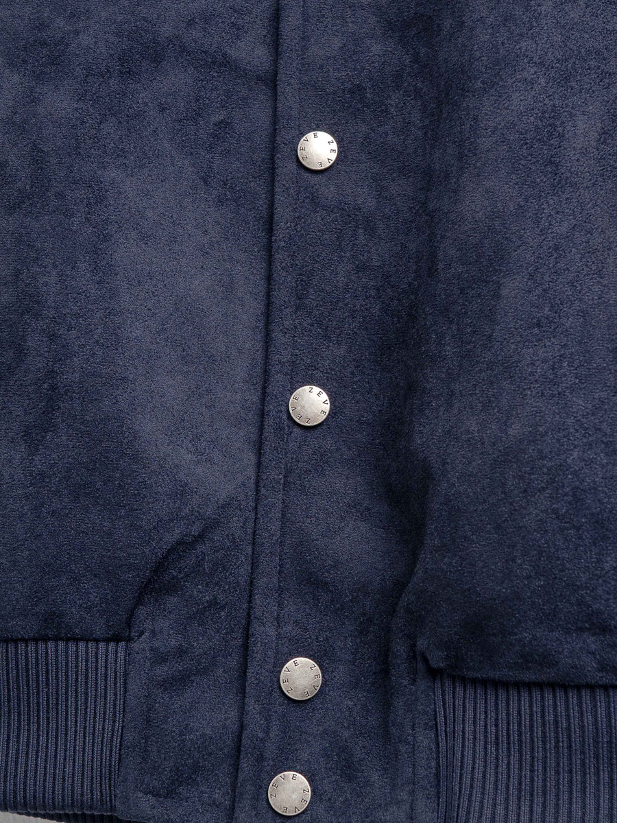 Navy blue men's jacket with textured fabric and branded buttons, stylish outerwear for formal or casual wear.
