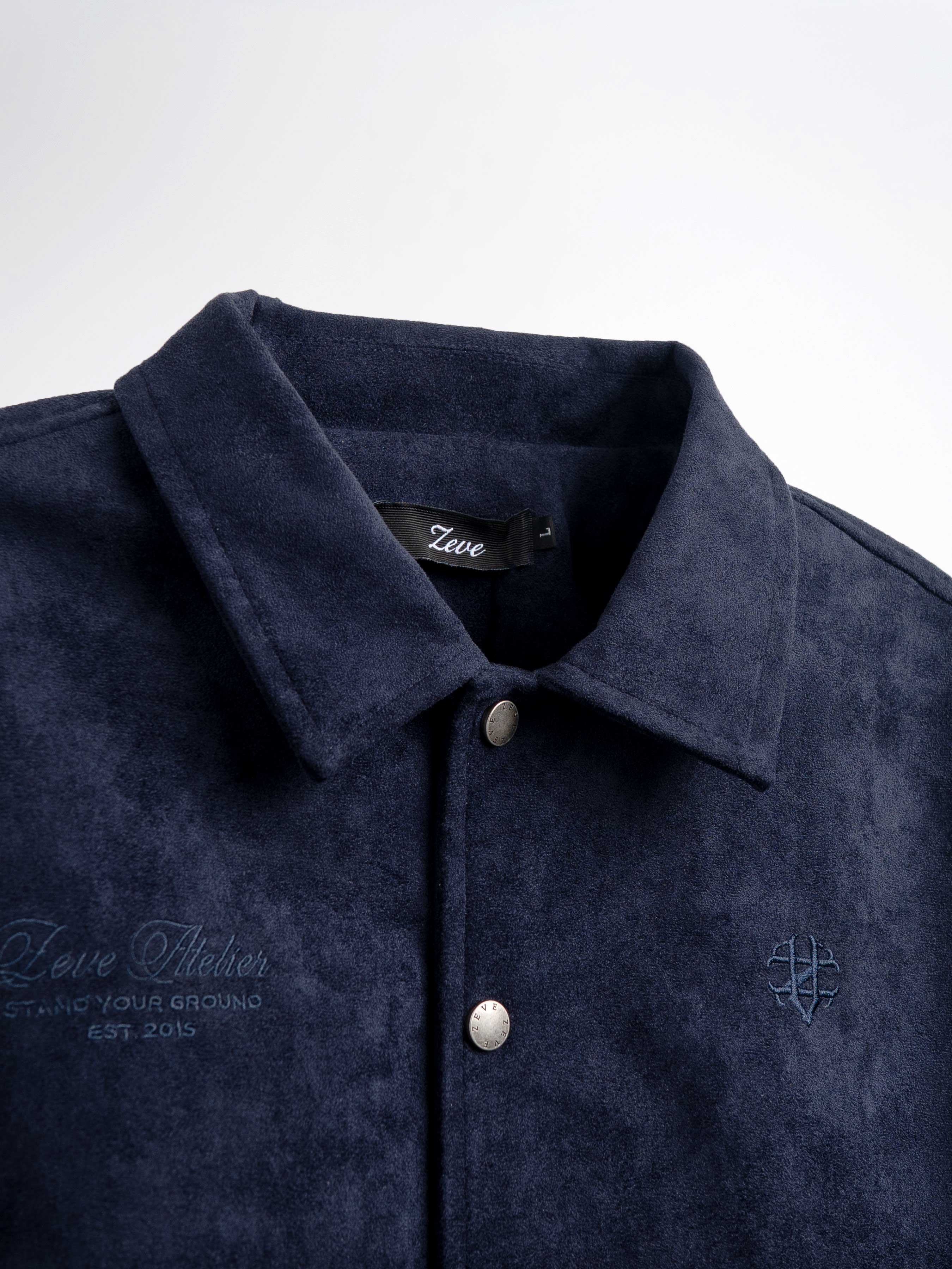 Navy blue men's suede shirt with embroidered logo and branded buttons, stylish casual wear