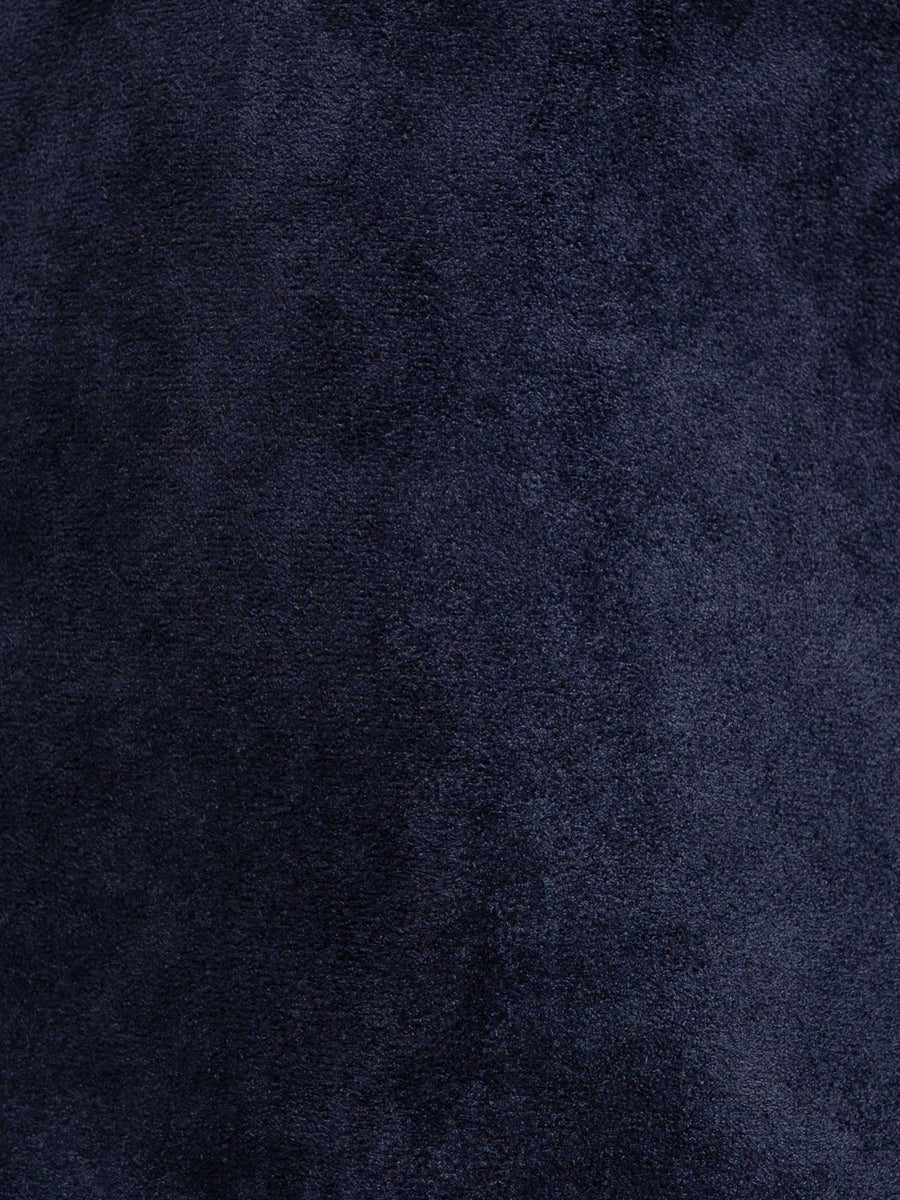 Navy blue textured men's apparel fabric close-up
