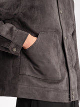Dark grey suede men's jacket with front pocket and button details, stylish casual outerwear