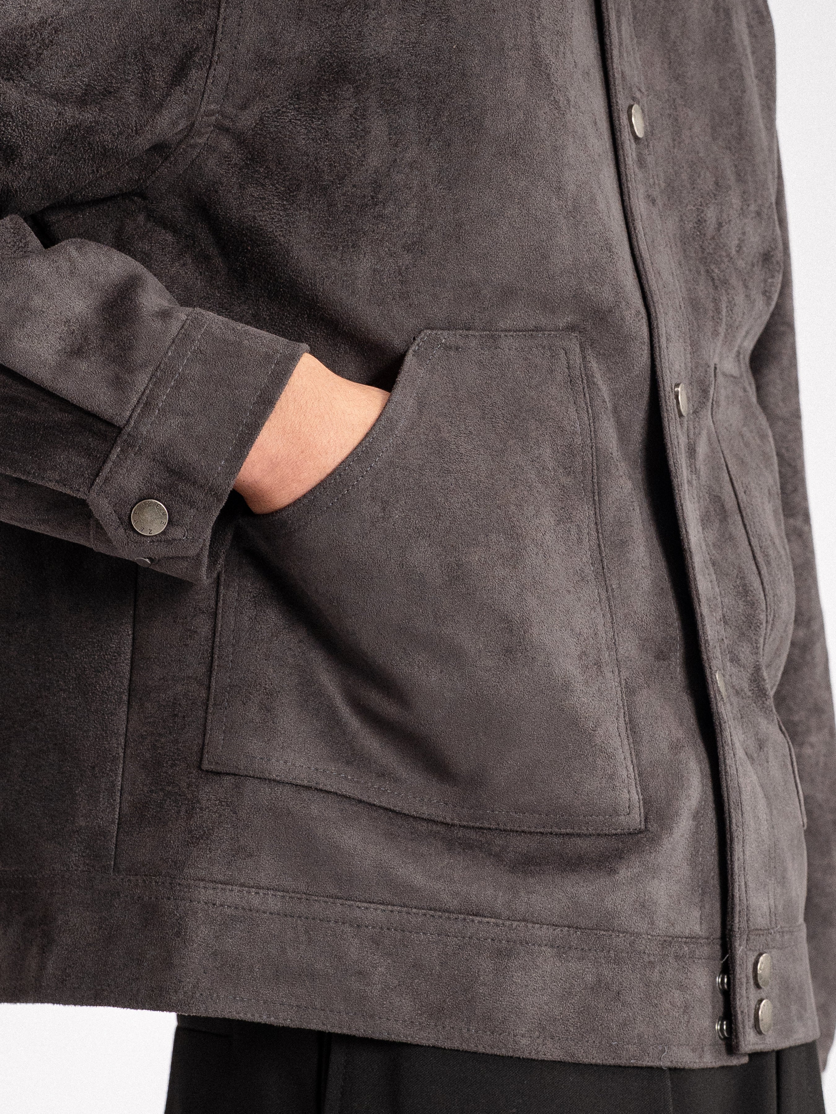 Dark grey suede men's jacket with front pocket and button details, stylish casual outerwear